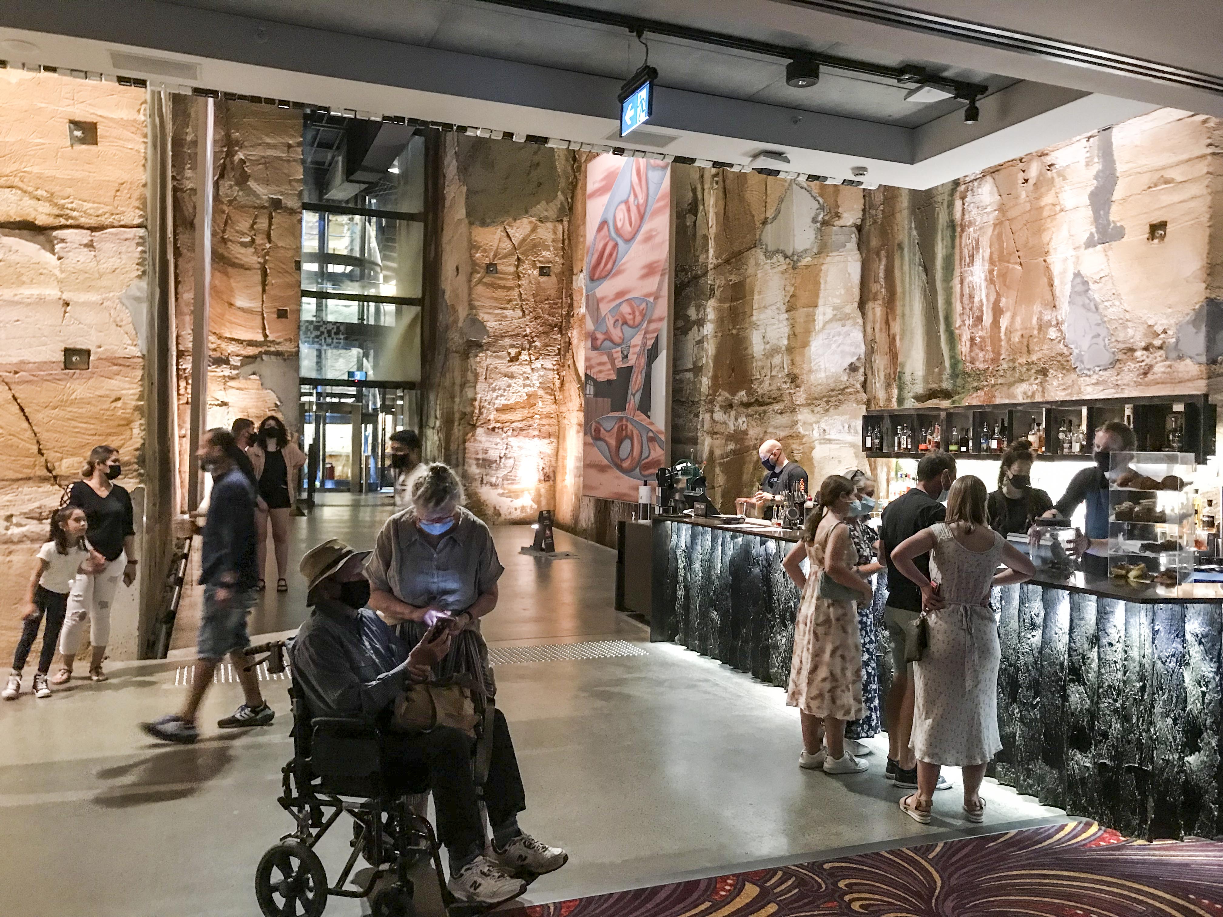 Void Bar with main entrance stairway and elevator in the background. The rock anchor outlet features are also apparent on the sandstone walls.