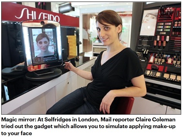 Magic mirror: At Selfridges in London, Mail reporter Claire Coleman
tried out the gadget which allows you to simulate applying make-up
to your face
